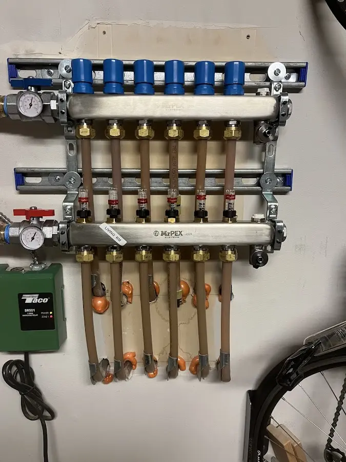 Plumber performing Water Heater Repair at a residential property in Brock Hall